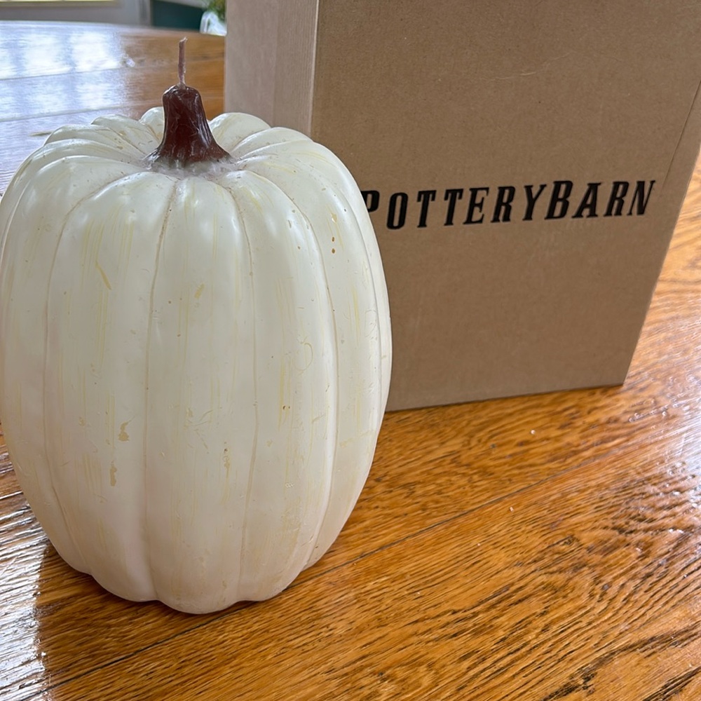Pottery Barn white pumpkin candle.  Unscented, approximately 9” tall.